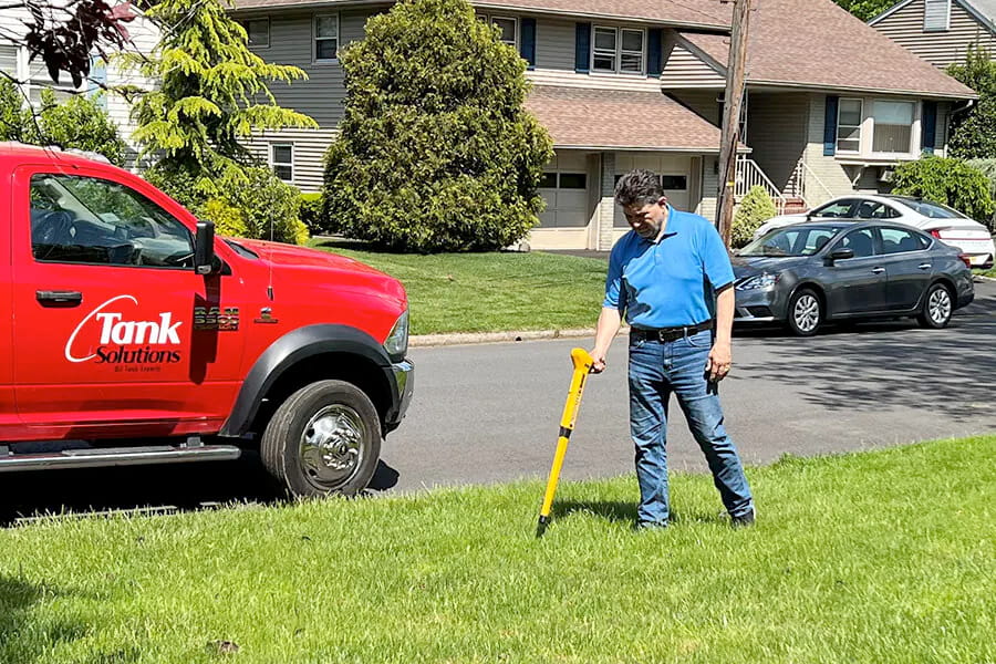 An image of a man completing an oil tank sweep to depict Tank Solutions's professional oil tank sweeps.