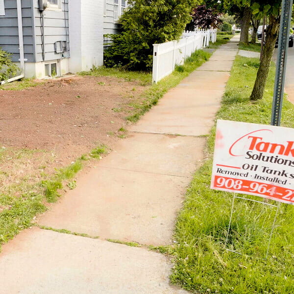 A picture of a New Jersey residential property with remediated soil after soil contamination was found and treated by Tank Solutions.