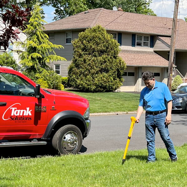 A Tank Solutions employee completing an underground oil tank sweep at a residential property in New Jersey.